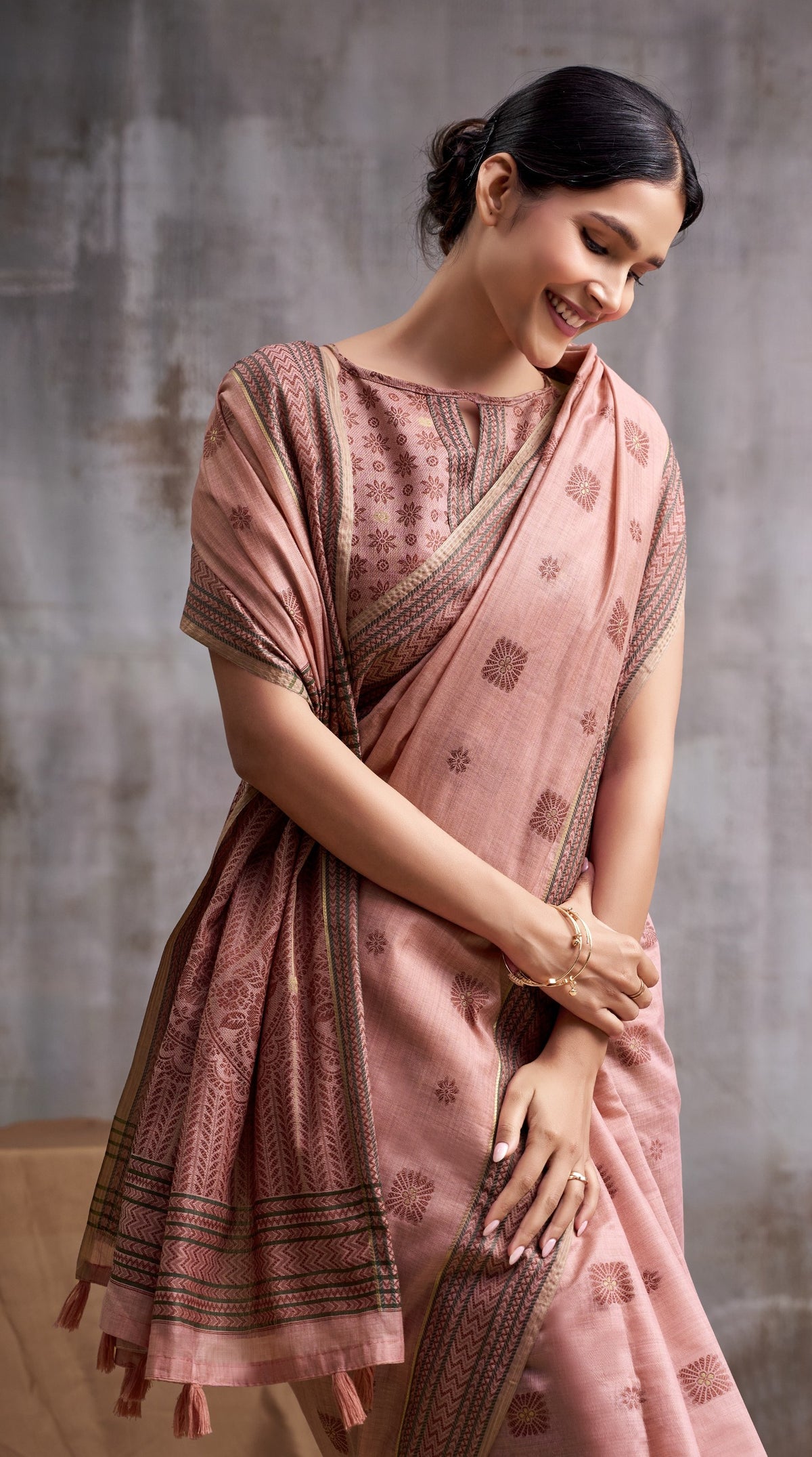 Peach Modal Cotton Saree with Floral Motifs & Traditional Tassel Pallu