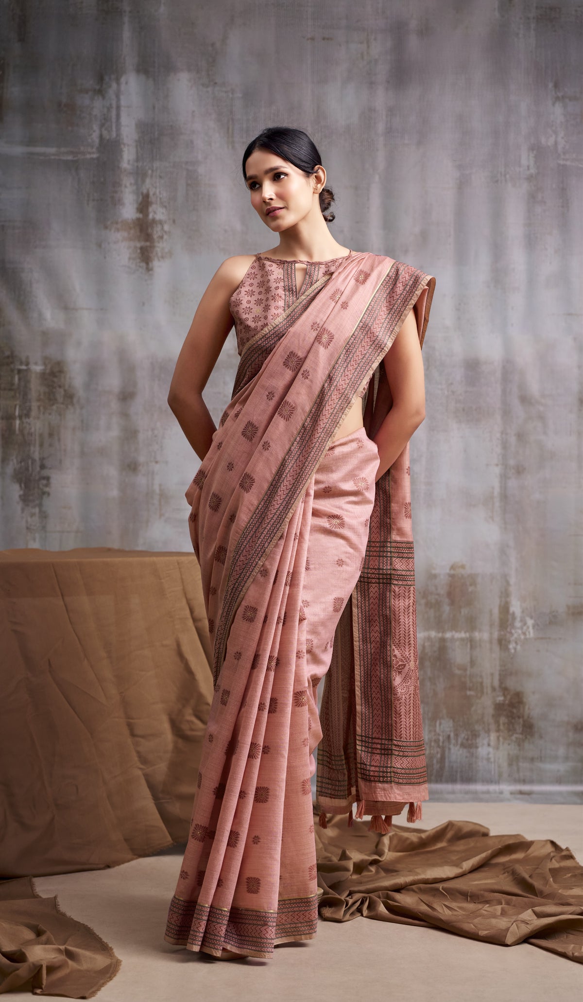Peach Modal Cotton Saree with Floral Motifs & Traditional Tassel Pallu