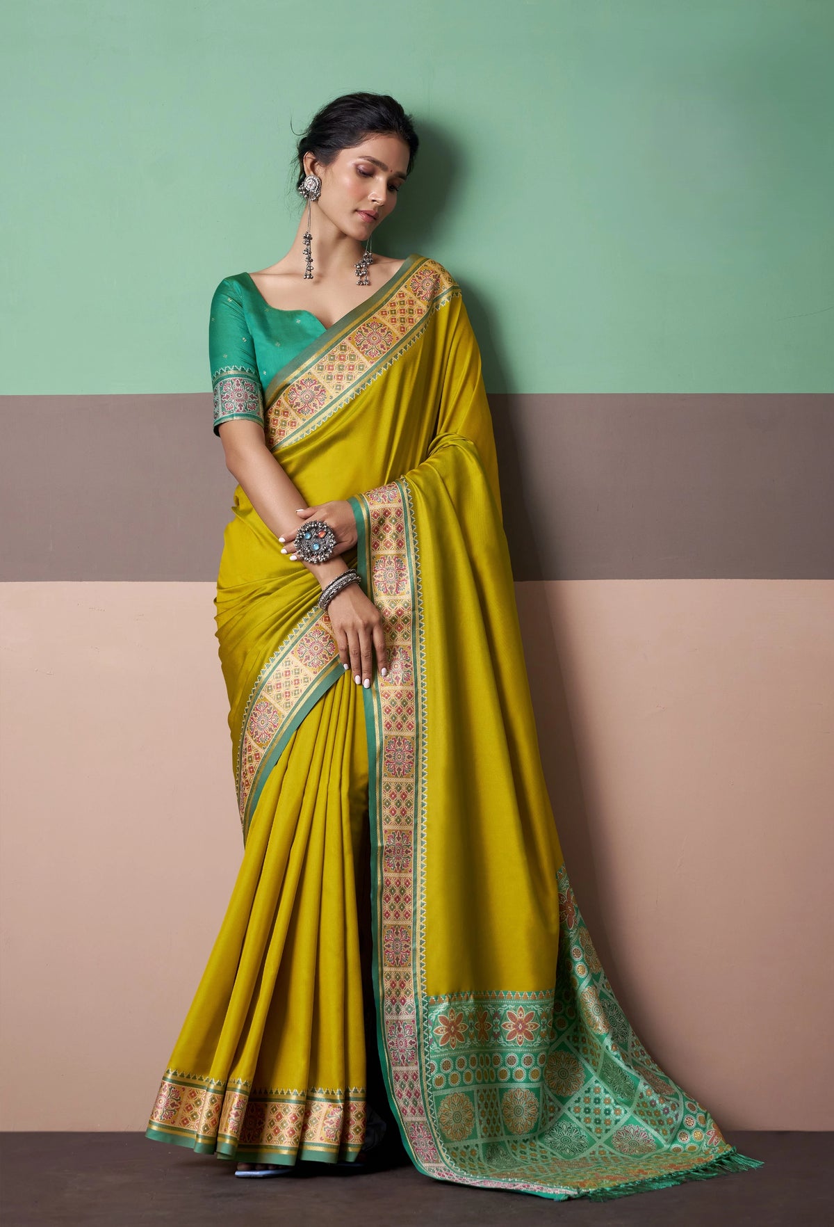 Mustard Yellow Patola Silk Saree with Traditional Floral Border
