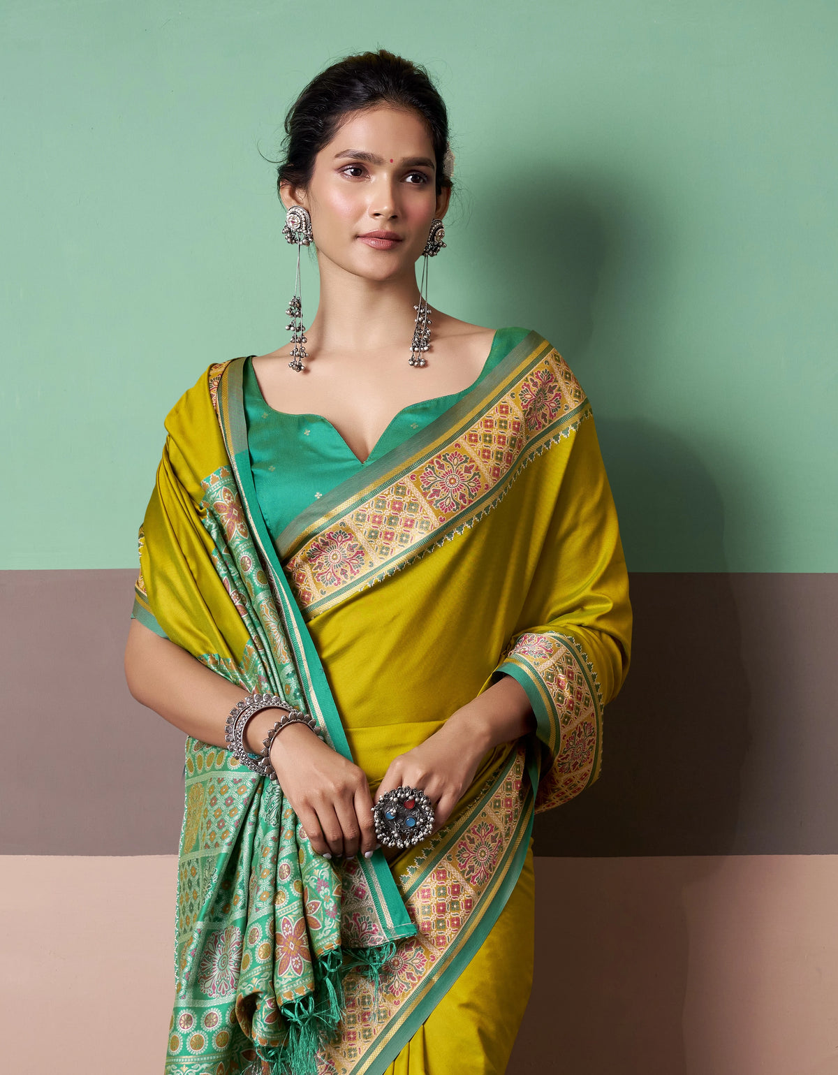 Mustard Yellow Patola Silk Saree with Traditional Floral Border