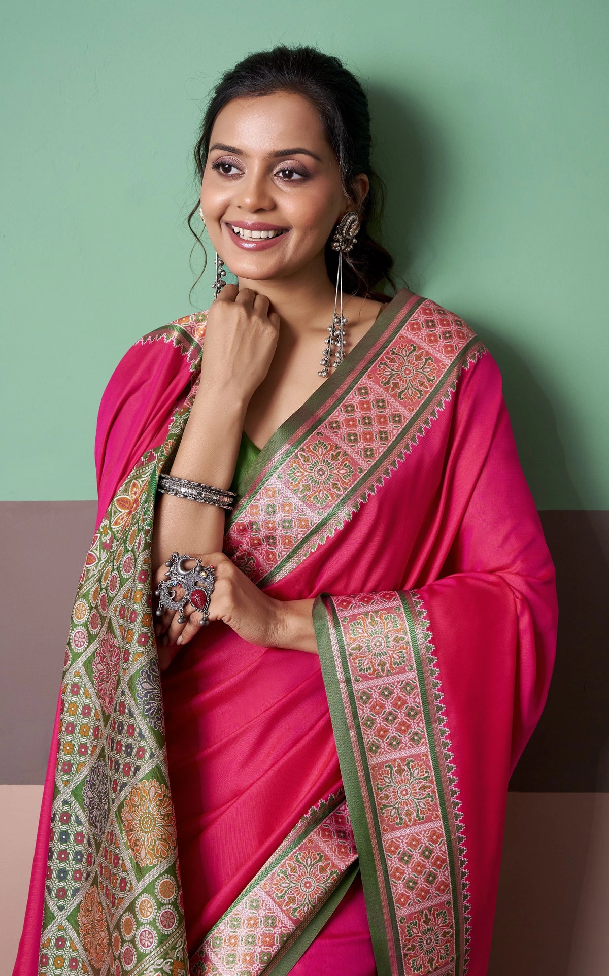 Rani Pink Patola Silk Saree with Traditional Floral Border & Multicolour Tassel Pallu