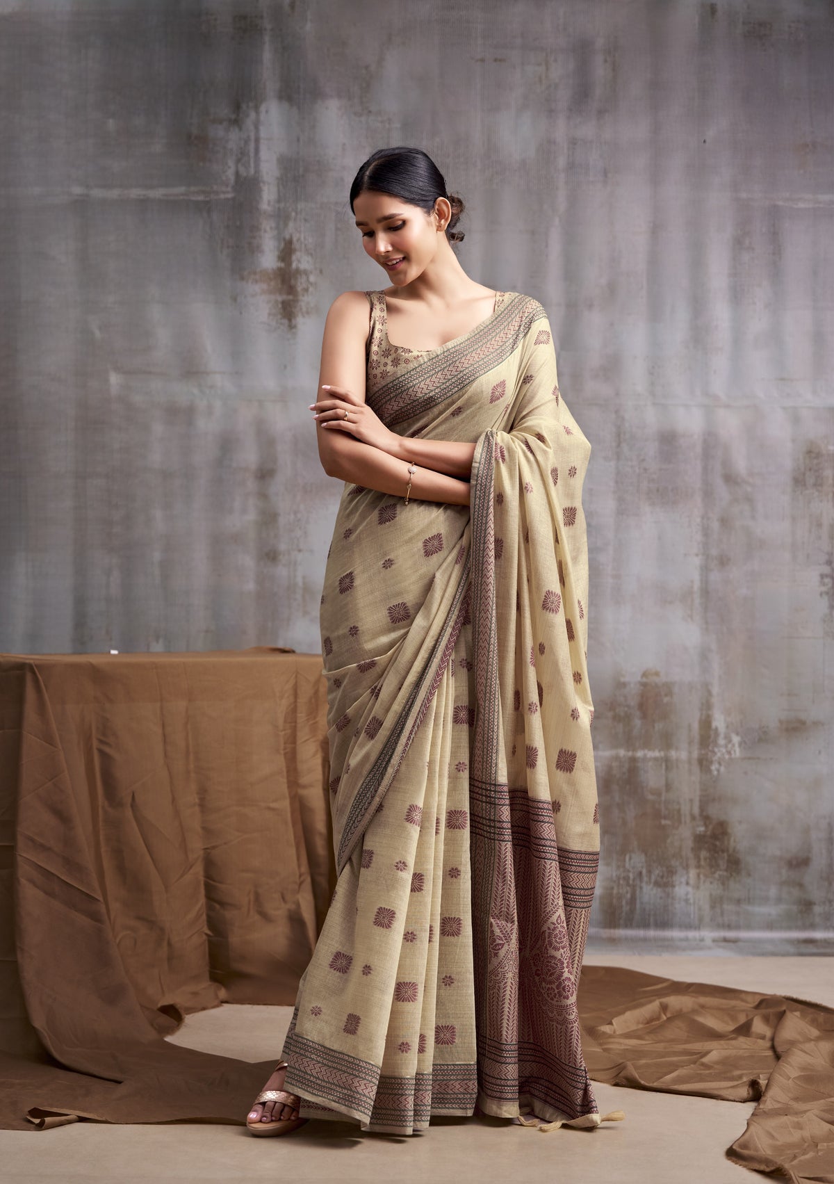 Classic Beige Modal Cotton Saree with Floral Motifs & Intricate Tassel Pallu